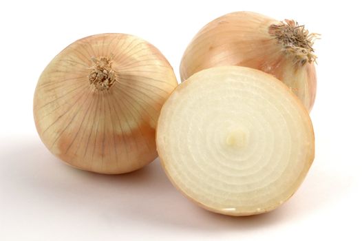 Yellow onions close-up on a white background.