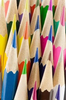 Stack of colored hexagon shaped pencils macro, selective focus