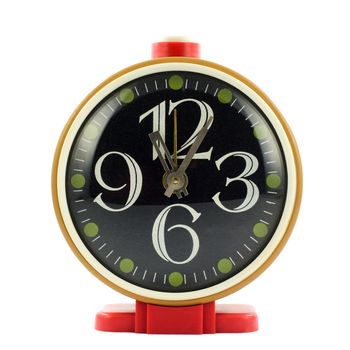 Vintage mechanical wind-up alarm clock over white isolated