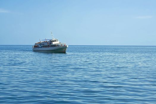Passenger boat on the black sea with tourists on the sea, a daily walk.