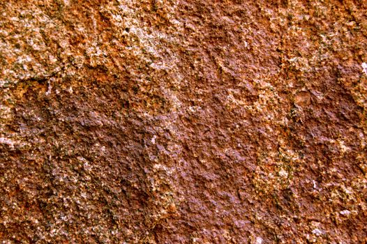 brown rough surface of wild stone .