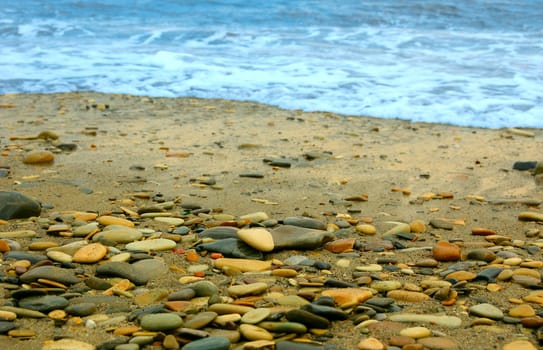 closeup of sea shore covered with pebbles