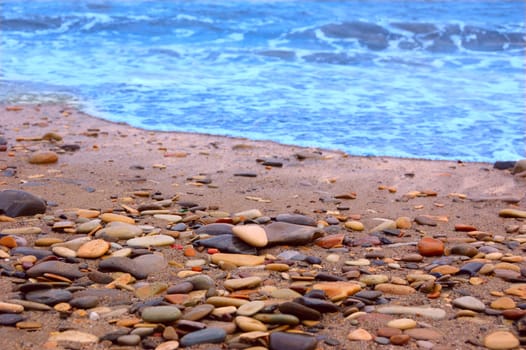 closeup of sea shore covered with pebbles