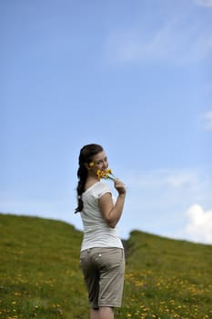 Woman enjoying her summer holidays at the mountains