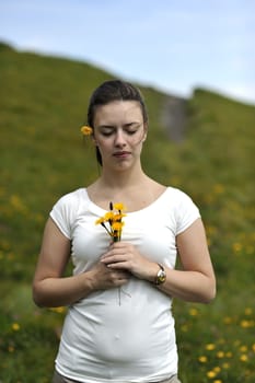 Woman enjoying her summer holidays at the mountains