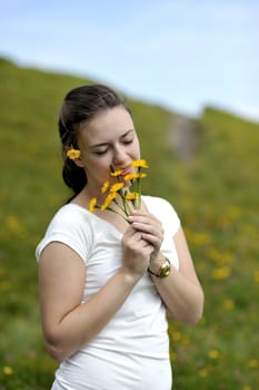 Woman enjoying her summer holidays at the mountains