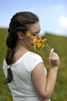 Woman enjoying her summer holidays at the mountains