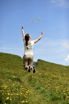 Woman enjoying her summer holidays at the mountains