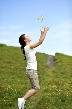 Woman enjoying her summer holidays at the mountains