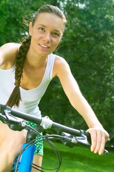 Active lady a bike ride in the park