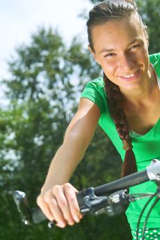 Active lady a bike ride in the park