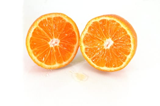 Fresh orange slices isolated on white.
