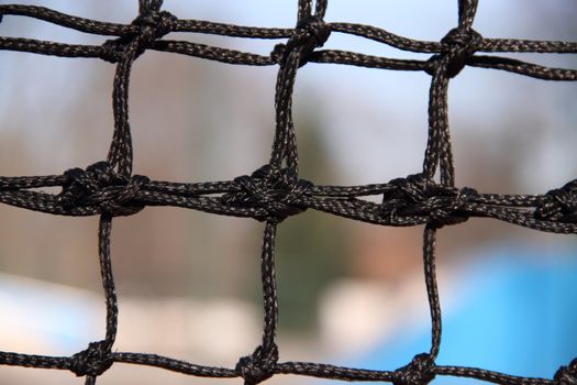 Very close view of the knots in a net.