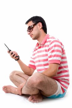 Young man with mobile phone on a white background.