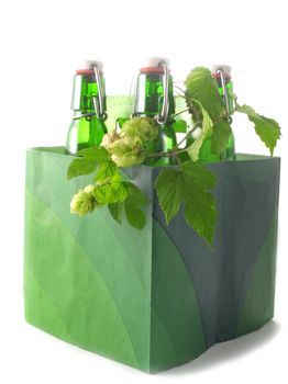 Box with green Beer bottles isolated on white
