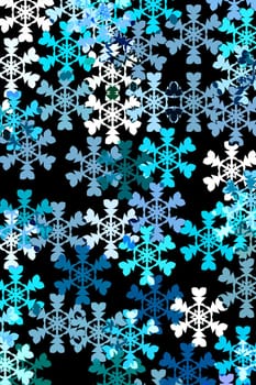 snowflakes in different blue colours and white on black background