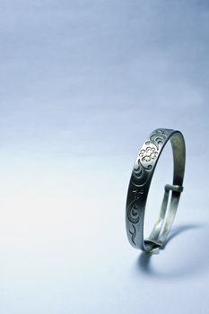 It is a iron bracelet on background.