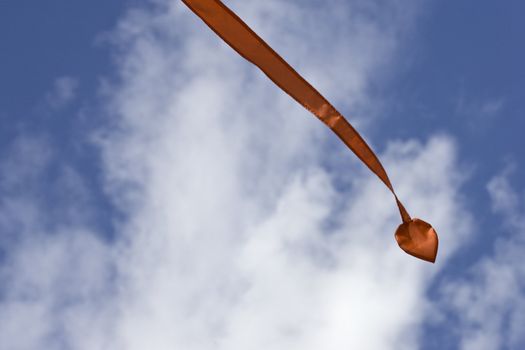 A streamer flying in the air on a bright summer day.