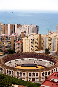 Bullring between buildings in Malaga, Andalusia, Spain