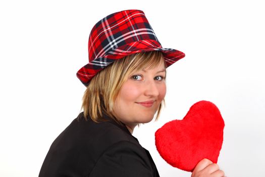 Young woman with velvet heart on white background