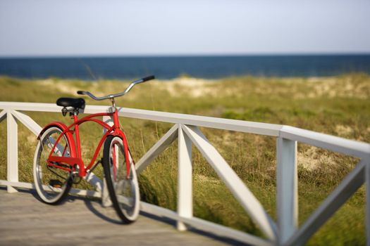 Bicycle leaning against rail on Bald Head Island, North Carolina