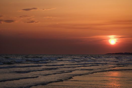 Sun setting over beach on Bald Head Island, North Carolina.