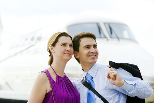 Businessman and his wife expect boarding on plane