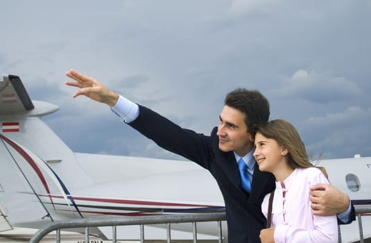 Father show his daughter airplane