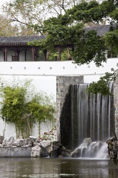 A typical Chinese garden with a pond.