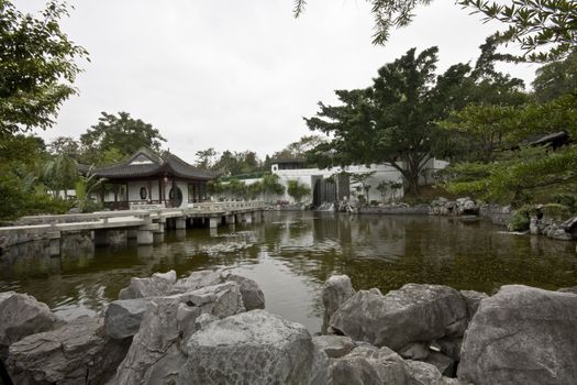 A typical Chinese garden with a pond.