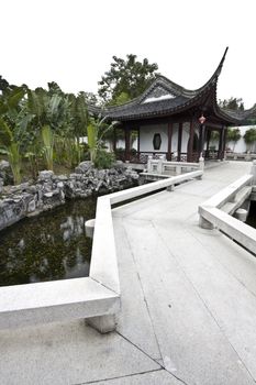 A typical Chinese garden with a pond.