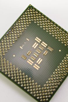 It is silicone chip CPU  on white background.