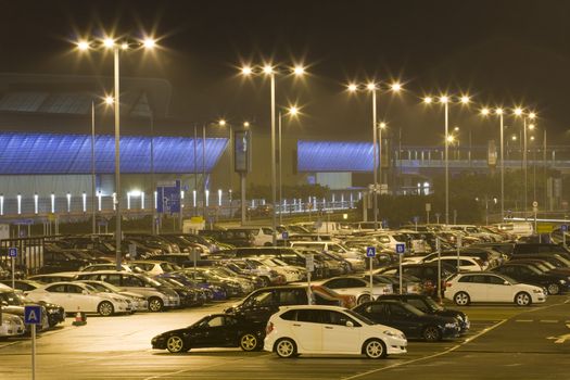 Compressed view of parked cars in car park 

