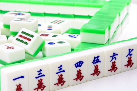 Chinese game similar to poker. Very popular gambling game.