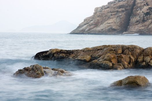 Long exposure of rock coast background