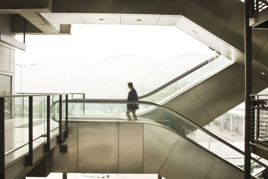 it is a business man move on escalator.