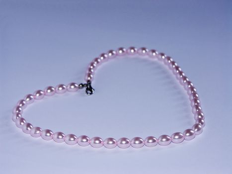 The image of the pearl beads combined in the form of heart