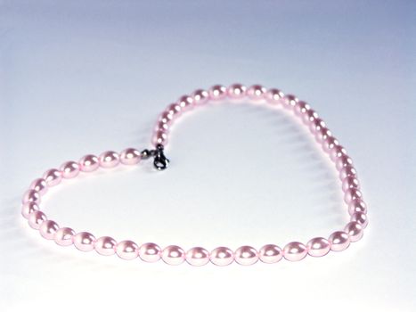 The image of the pearl beads combined in the form of heart