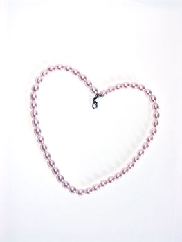 The image of the pearl beads combined in the form of heart