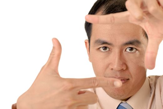 Businessman in focus by hands with confident expression on white background.