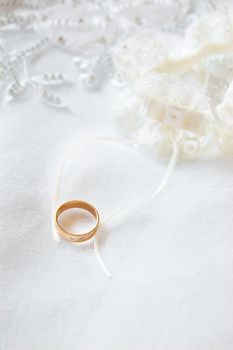 Wedding ring on satin and lace