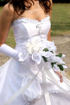 bride in wedding dress and holding bouquet