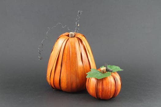 Artistic pumpkin fashioned from natural materials and isolated with copy space.
