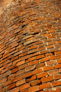Close up of a curved brick wall. Old bricks. Suitable as background.
