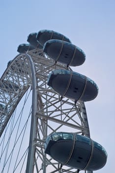 London Eye glowing pink at dusk