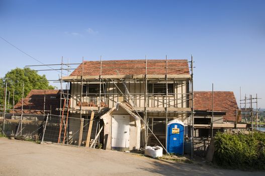 Scaffolding around a new house in the countryside