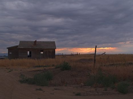 old farm shack under a thunderstorm on the prairie of Eastern Colorado