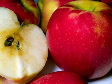 A small pile of fresh cut green and red apples