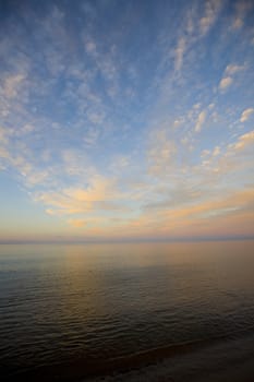 Clouds, horizon, an water during a sunset on the banks of Lake Superior.