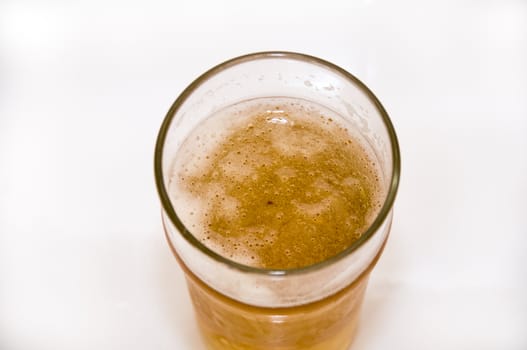 A pint of beer isolated on a white background